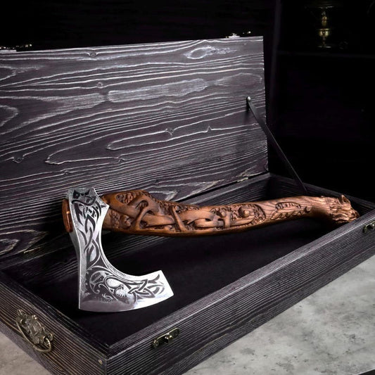 Hand-forged Viking bearded axe with mirror-polished high-carbon steel blade, engraved runic hardwood handle, and custom hand-carved eagle head pommel.