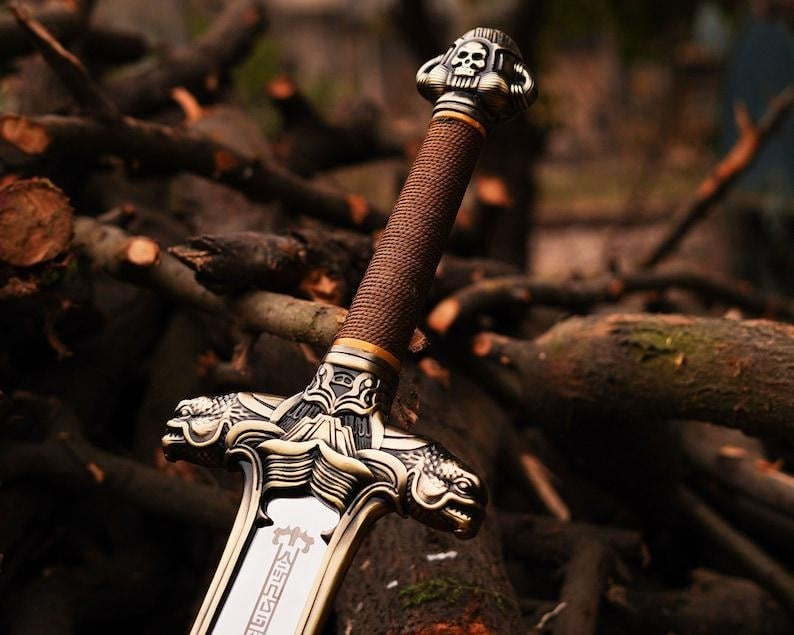 Conan the Barbarian Father’s Sword replica featuring dual dragon crossguard and moose-head pommel on a high carbon steel blade.