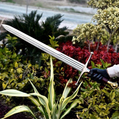 Wonder Woman God Killer Sword replica with golden dual-dragon hilt and etched Amazonian runes on a polished steel blade.